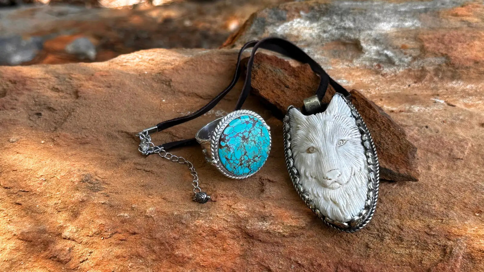 Silver wolf head pendant with turquoise stone ring on black leather cord