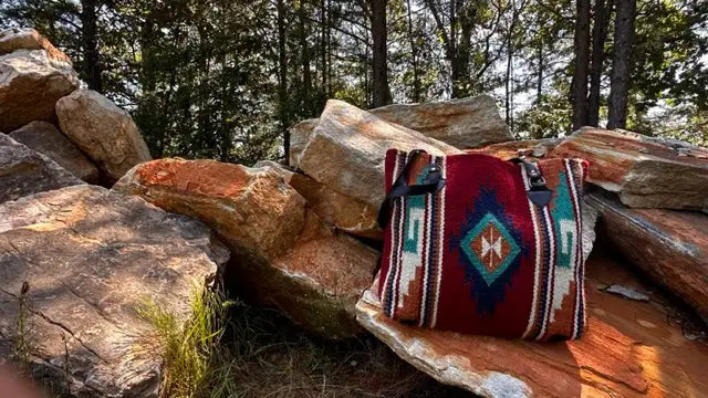 Southwestern patterned tote bag with red, blue and white geometric designs.
