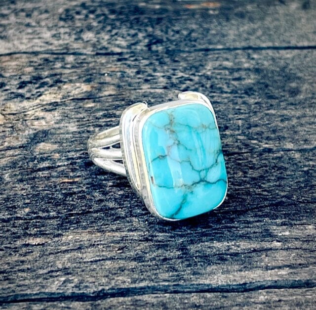 On Lucky Ground Kingman Turquoise Horseshoe Ring | Yellowstone Spirit Southwestern Collection tilted 3 shank silver turquoise ring